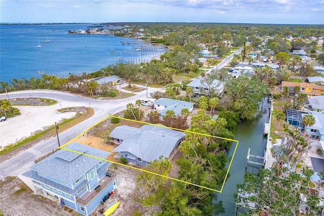 birds eye view of property featuring a residential view and a water view