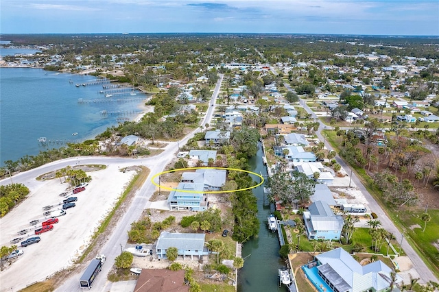 aerial view featuring a residential view and a water view