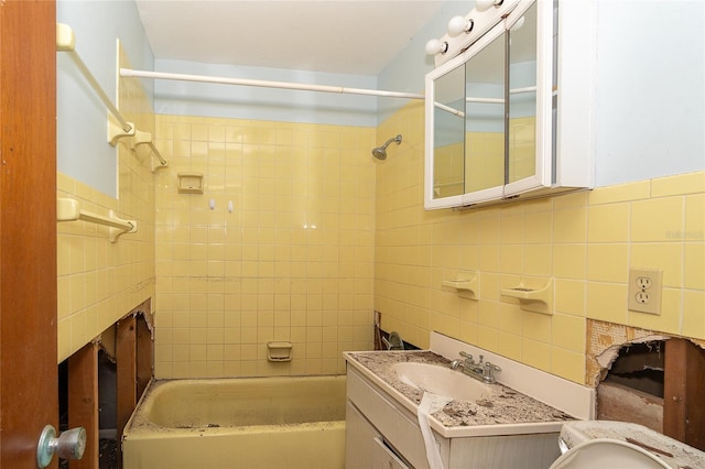 full bath featuring decorative backsplash, tub / shower combination, tile walls, and vanity