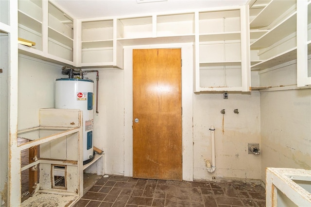 laundry room featuring laundry area and electric water heater