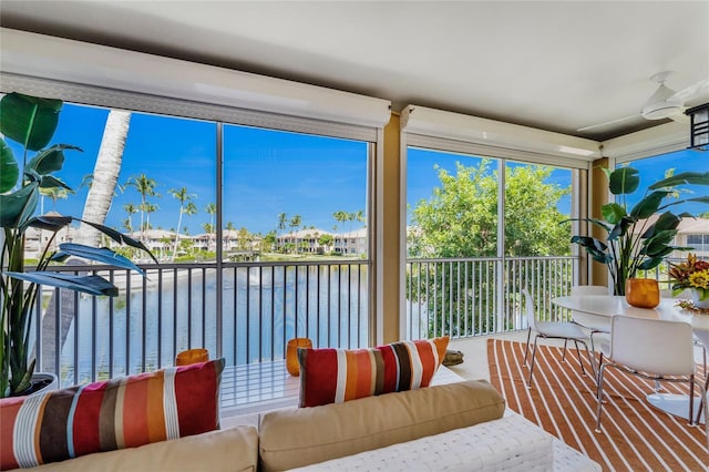 sunroom / solarium with a water view