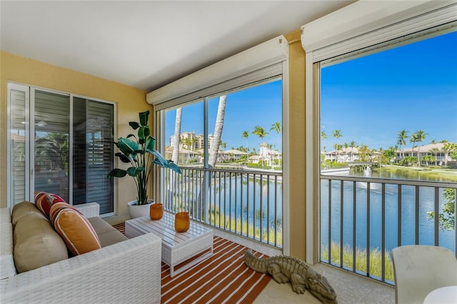 sunroom with a water view