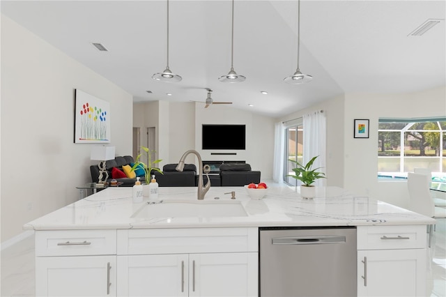 kitchen featuring dishwasher, open floor plan, and white cabinetry