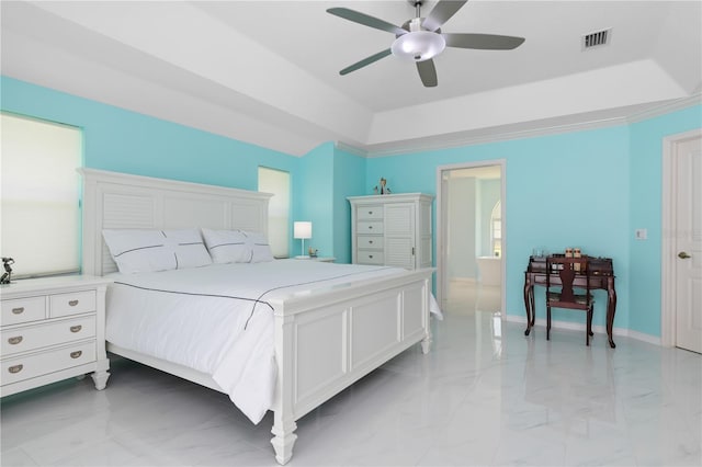 bedroom with a raised ceiling, visible vents, marble finish floor, and baseboards