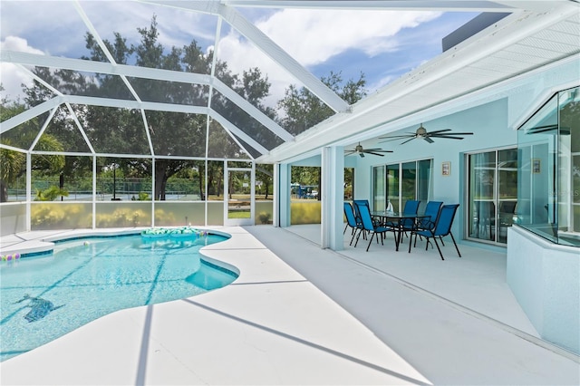 pool with a lanai, a patio area, a ceiling fan, and outdoor dining space