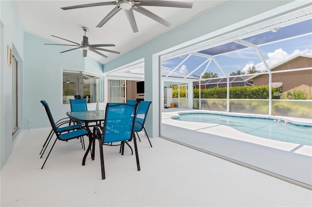 outdoor pool with a lanai and a patio area