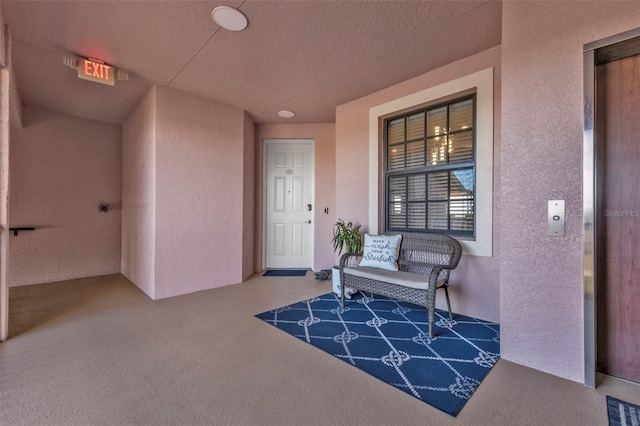 doorway to property featuring a porch and visible vents