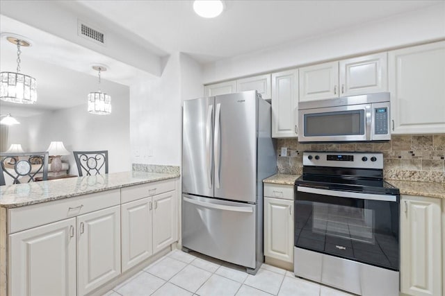 kitchen featuring visible vents, white cabinets, appliances with stainless steel finishes, tasteful backsplash, and pendant lighting