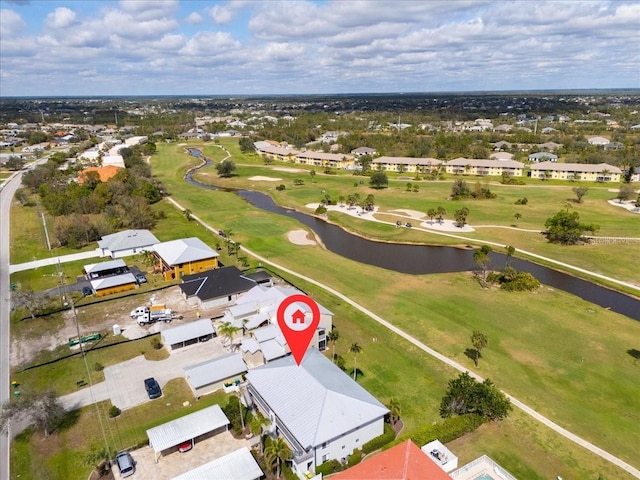 bird's eye view featuring a water view, a residential view, and golf course view