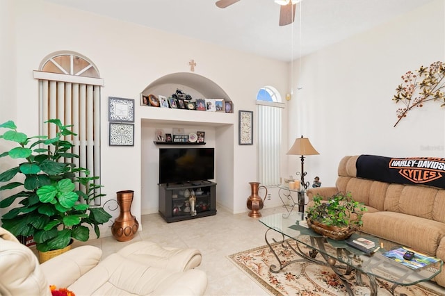 living room featuring tile patterned flooring and ceiling fan