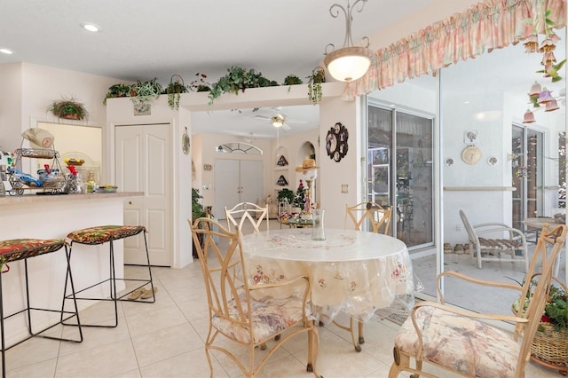 dining area featuring a ceiling fan, recessed lighting, and light tile patterned floors