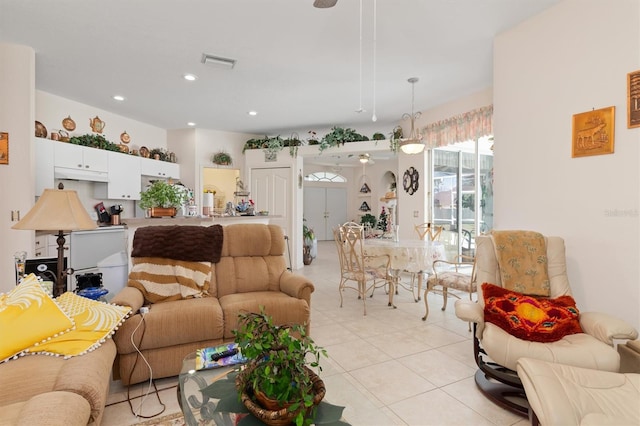 living room featuring recessed lighting, visible vents, and light tile patterned flooring