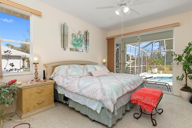 carpeted bedroom featuring a sunroom, access to outside, and ceiling fan