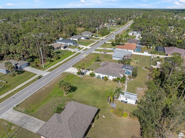 birds eye view of property with a forest view