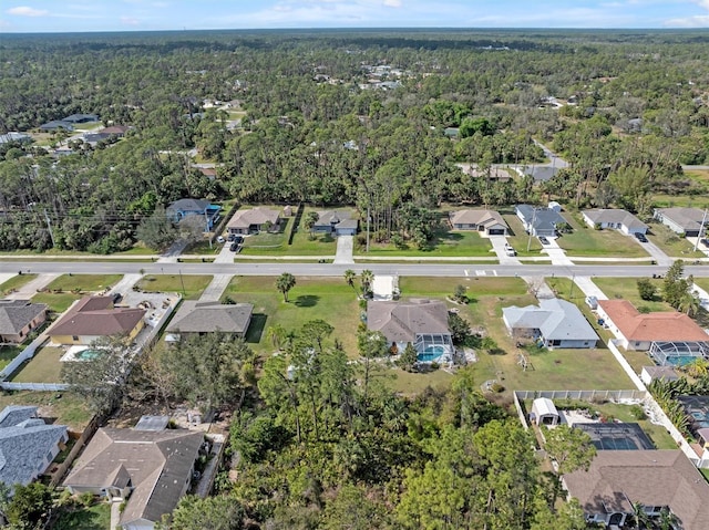 bird's eye view featuring a residential view and a view of trees