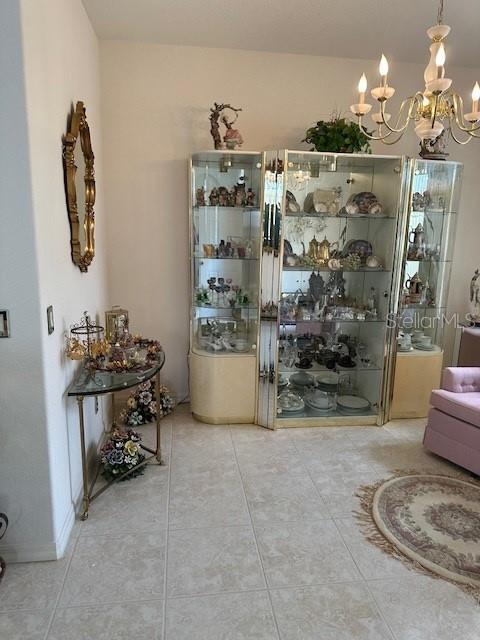 3816 N Cranberry Blvd, North Port, FL 34286 - tiled dining area with a chandelier