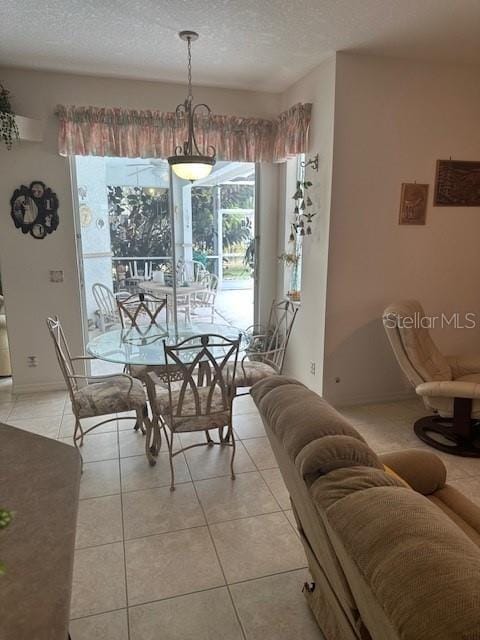 3816 N Cranberry Blvd, North Port, FL 34286 - dining room with healthy amount of natural light, a textured ceiling, and light tile patterned floors