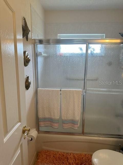 3816 N Cranberry Blvd, North Port, FL 34286 - bathroom with enclosed tub / shower combo and toilet