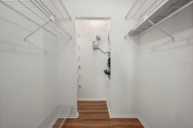 spacious closet with wood finished floors