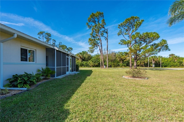 view of yard featuring a sunroom