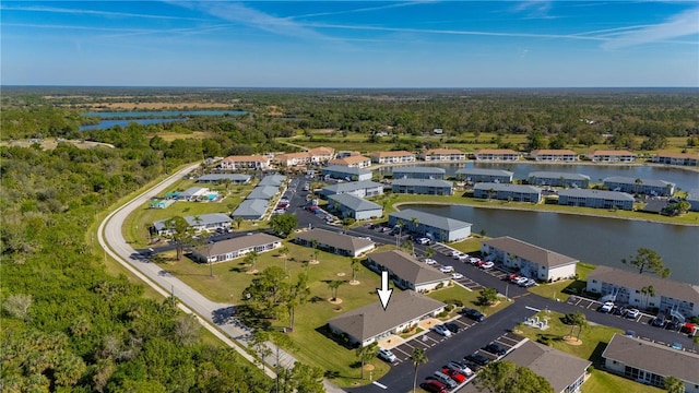 aerial view with a water view, a residential view, and a view of trees