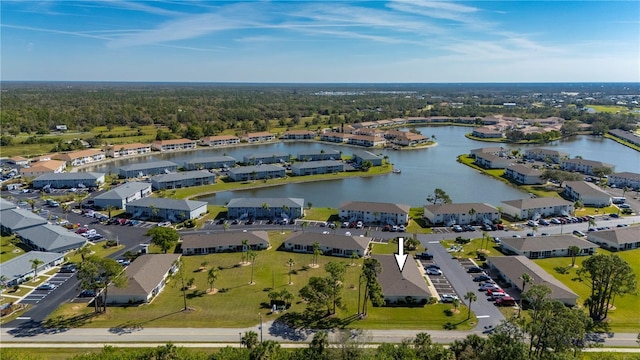 drone / aerial view with a residential view and a water view