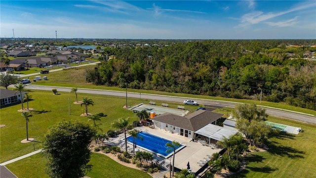 bird's eye view featuring a residential view and a wooded view