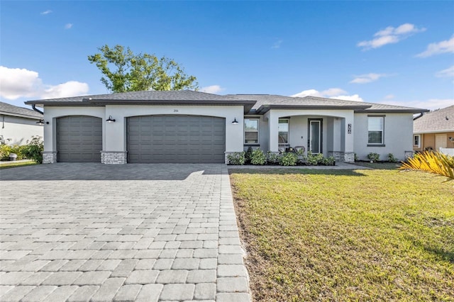 view of front facade with a garage, a front lawn, decorative driveway, and stucco siding