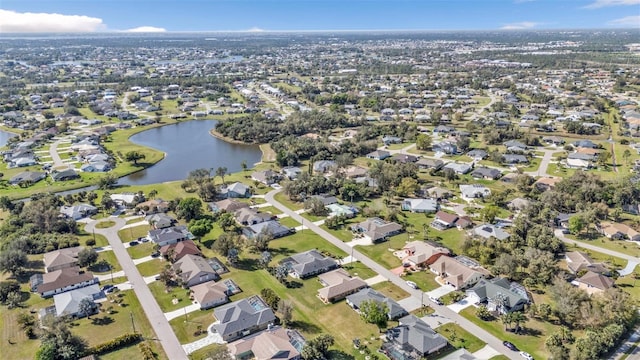 birds eye view of property featuring a water view and a residential view