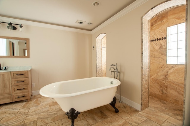 full bathroom featuring ornamental molding, a soaking tub, vanity, and baseboards