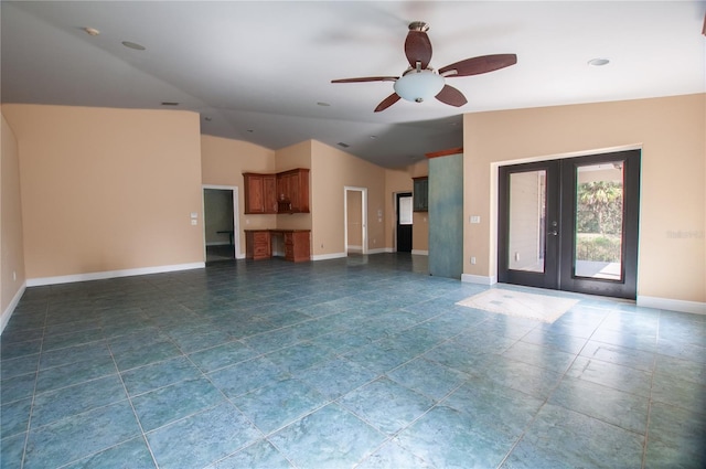 unfurnished living room featuring lofted ceiling, baseboards, a ceiling fan, and french doors