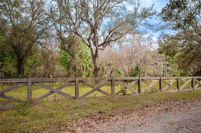 view of gate featuring fence