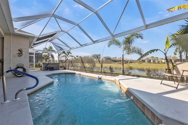 pool with a lanai, a water view, a patio, and a hot tub