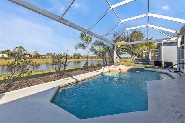 outdoor pool featuring a patio area, a water view, and a lanai