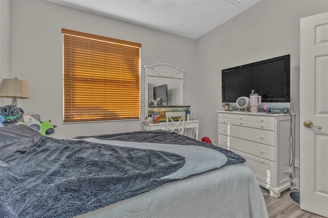 bedroom with wood finished floors