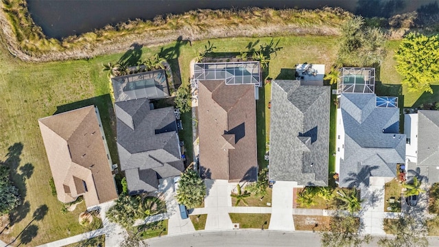 birds eye view of property with a residential view