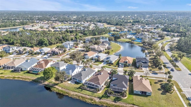 birds eye view of property featuring a residential view and a water view