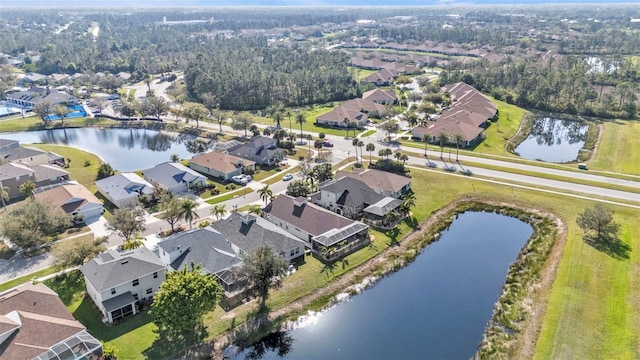 aerial view featuring a water view and a residential view