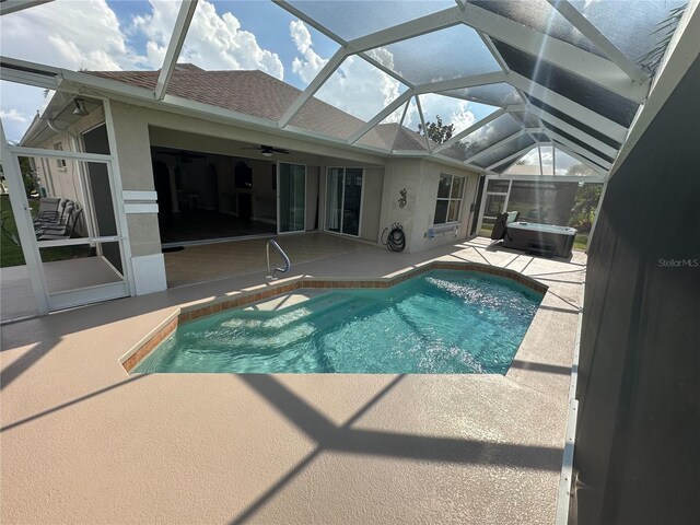 1859 Scarlett Ave, North Port, FL 34289 - swimming pool with a hot tub, a patio, and glass enclosure