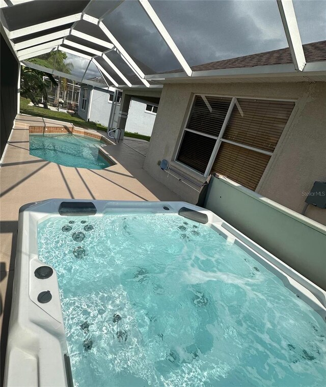 1859 Scarlett Ave, North Port, FL 34289 - view of pool with a swimming pool, a hot tub, a lanai, and a patio