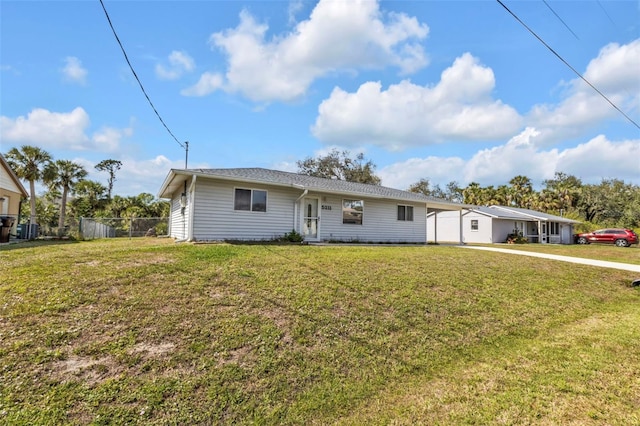 ranch-style home featuring a front yard and fence