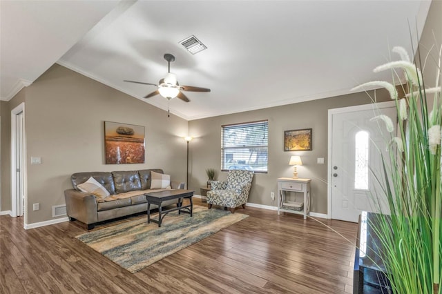 living room featuring vaulted ceiling, dark wood finished floors, and visible vents