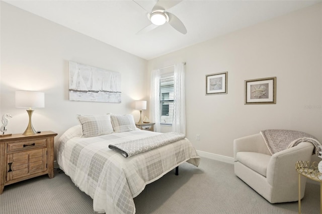 bedroom featuring ceiling fan, carpet, and baseboards