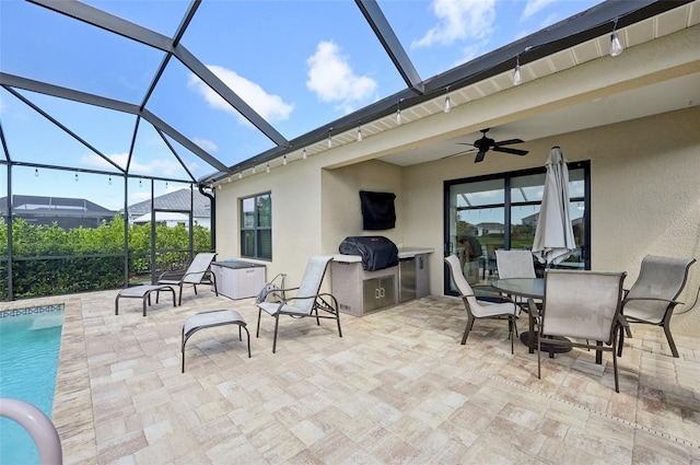 view of patio with a lanai, outdoor dining area, an outdoor pool, and a ceiling fan