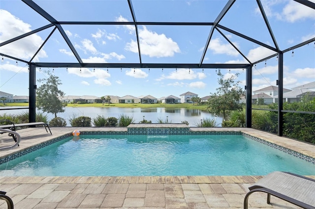 outdoor pool featuring a water view, glass enclosure, a residential view, and a patio