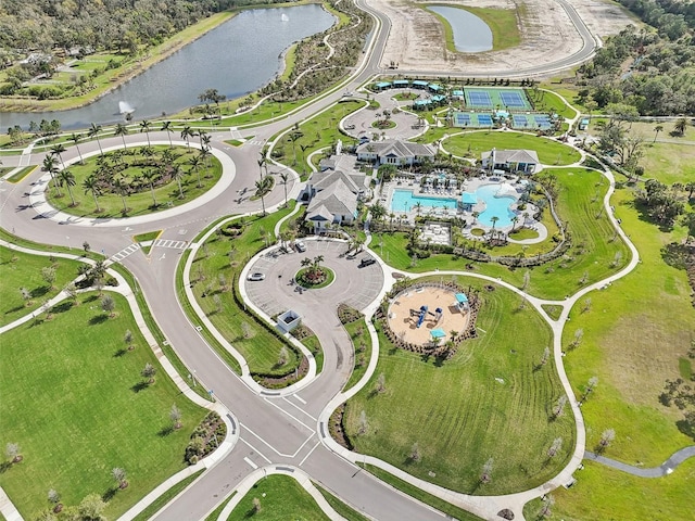 birds eye view of property with a water view