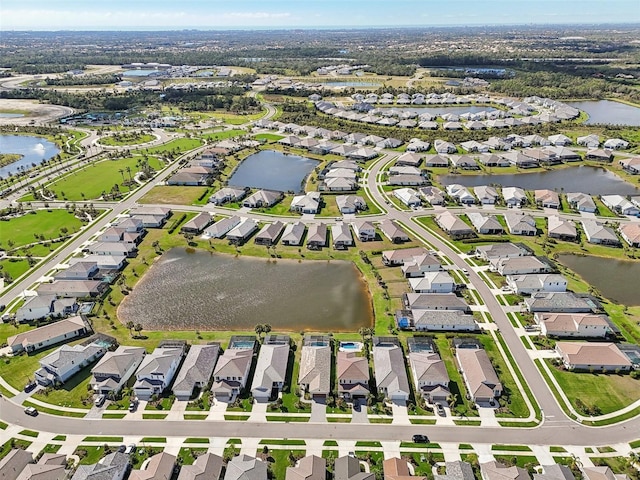 bird's eye view featuring a water view and a residential view