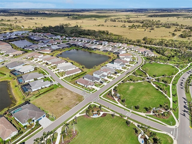 bird's eye view with a water view and a residential view