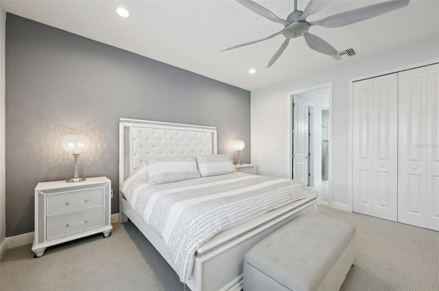 bedroom featuring light carpet, a closet, baseboards, recessed lighting, and a ceiling fan