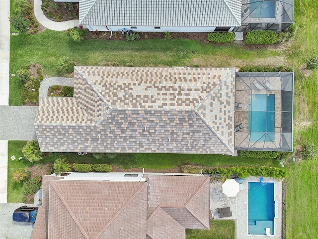 view of subject property with a pool